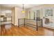 Open dining area with hardwood floors, natural light, and seamless transition to kitchen at 4741 W Lake Se Dr, Conyers, GA 30094