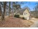 View of the home's side exterior showcasing siding, windows, and garage at 4741 W Lake Se Dr, Conyers, GA 30094