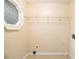 Laundry room with washer hookups and plenty of shelf storage in a bright and airy space at 4741 W Lake Se Dr, Conyers, GA 30094