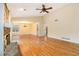 Spacious open-concept living room featuring stone fireplace, hardwood floors, and ample natural light at 4741 W Lake Se Dr, Conyers, GA 30094