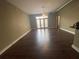Open living area with hardwood floors and access to balcony at 502 Pryor Sw St # 322, Atlanta, GA 30312