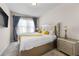 Guest bedroom with a queen bed and stylish nightstand at 53 Cottontail Ln, Loganville, GA 30052