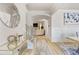 Bright and spacious entryway with hardwood floors, a large mirror, and views into the living room at 53 Cottontail Ln, Loganville, GA 30052