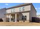 Two-story house with covered patio, and spacious backyard at 53 Cottontail Ln, Loganville, GA 30052