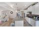 Modern kitchen with white cabinets, granite countertops, large island, and stainless steel appliances at 53 Cottontail Ln, Loganville, GA 30052