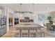 Modern kitchen with white cabinets, granite countertops, large island, and stainless steel appliances at 53 Cottontail Ln, Loganville, GA 30052