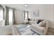 Bright living room featuring a large sectional sofa and stylish rug at 53 Cottontail Ln, Loganville, GA 30052