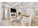 Spacious living room with a modern fireplace, large sectional sofa, and high ceilings at 53 Cottontail Ln, Loganville, GA 30052
