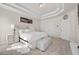 Main bedroom with coffered ceiling, large bed, and ensuite bathroom access at 53 Cottontail Ln, Loganville, GA 30052