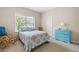 Bedroom with a blue dresser and a rocking chair at 5540 Fords Crossing Nw Ct, Acworth, GA 30101