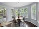 Bright breakfast nook with window seating and wood floors at 5540 Fords Crossing Nw Ct, Acworth, GA 30101