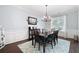 Formal dining room featuring hardwood floors, chandelier, and ample natural light at 5540 Fords Crossing Nw Ct, Acworth, GA 30101