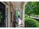 Relaxing front porch with two chairs, offering curb appeal and a welcoming atmosphere at 5540 Fords Crossing Nw Ct, Acworth, GA 30101