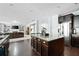 Open concept kitchen with island and view of living room at 5540 Fords Crossing Nw Ct, Acworth, GA 30101