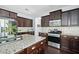 Island kitchen with granite countertops and stainless steel appliances at 5540 Fords Crossing Nw Ct, Acworth, GA 30101