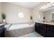 Elegant main bathroom with soaking tub, granite vanity, and walk-in shower at 5540 Fords Crossing Nw Ct, Acworth, GA 30101