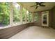 Screened porch with a ceiling fan and views of the backyard at 5540 Fords Crossing Nw Ct, Acworth, GA 30101