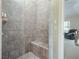 Spacious walk-in shower with built-in bench and glass enclosure at 5540 Fords Crossing Nw Ct, Acworth, GA 30101