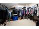 Large walk-in closet with ample hanging space and shelving at 5540 Fords Crossing Nw Ct, Acworth, GA 30101