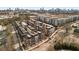 Aerial view of modern townhomes with rooftop terraces in an urban setting with downtown skyline at 1244 Chelsea Nw Cir, Atlanta, GA 30318