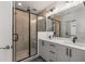 Modern bathroom featuring a glass shower, double vanity with sleek hardware, and contemporary fixtures at 1244 Chelsea Nw Cir, Atlanta, GA 30318