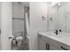 Bathroom featuring neutral tile, sleek vanity with sink, and a shower/tub combination with modern features at 1244 Chelsea Nw Cir, Atlanta, GA 30318