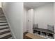 Well-organized entryway featuring stairs, shoe storage, bench seating, and clean decor at 1244 Chelsea Nw Cir, Atlanta, GA 30318