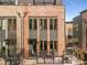 Contemporary townhome showcasing a brick facade and private patio at 1244 Chelsea Nw Cir, Atlanta, GA 30318