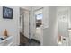 Bright hallway featuring light walls, hardwood floors, and access to an outside balcony at 1244 Chelsea Nw Cir, Atlanta, GA 30318