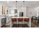 Spacious kitchen boasts white cabinets, an island with seating, and stainless steel appliances at 1244 Chelsea Nw Cir, Atlanta, GA 30318