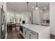 Modern kitchen with a large island, white cabinetry, and stainless steel appliances at 1244 Chelsea Nw Cir, Atlanta, GA 30318