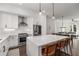Open concept kitchen with stainless steel appliances and an island overlooking the living area at 1244 Chelsea Nw Cir, Atlanta, GA 30318
