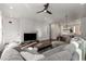 Open-concept living area with hardwood floors, sectional sofa, and modern chandelier at 1244 Chelsea Nw Cir, Atlanta, GA 30318