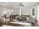 Spacious living room with hardwood floors, large sectional sofa, and open kitchen at 1244 Chelsea Nw Cir, Atlanta, GA 30318