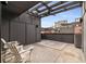 A cozy outdoor patio area featuring a pergola, ceiling fan, and stylish rugs at 1244 Chelsea Nw Cir, Atlanta, GA 30318
