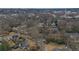 Aerial view of a neighborhood showcasing single-Gathering homes and mature trees, near to an urban environment at 257 Vance Ne Cir, Marietta, GA 30060