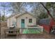 Backyard space features a small deck area, a rustic grill station, and a shed for storage at 257 Vance Ne Cir, Marietta, GA 30060