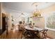 Open dining room showcasing hardwood floors, chandelier, and view into living space at 257 Vance Ne Cir, Marietta, GA 30060