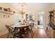 Dining room featuring hardwood floors, a chandelier, and easy access to kitchen at 257 Vance Ne Cir, Marietta, GA 30060