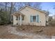 Home exterior featuring stone pathway, window boxes, and light yellow siding at 257 Vance Ne Cir, Marietta, GA 30060