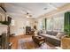 Bright living room with hardwood floors, beamed ceilings, and large windows at 257 Vance Ne Cir, Marietta, GA 30060