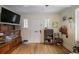 Living room with hardwood floors, white trim, and built-in shelving at 257 Vance Ne Cir, Marietta, GA 30060