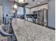 Modern kitchen with a large granite island and stainless steel appliances at 361 17Th Nw St # 1121, Atlanta, GA 30363