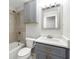 Clean bathroom with grey vanity, tile shower, and updated toilet at 3680 Admiral Dr, Chamblee, GA 30341