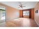 Peach colored bedroom with hardwood floors and a ceiling fan at 4618 Shallowford Rd, Roswell, GA 30075