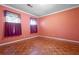 Spacious bedroom with parquet flooring and two windows at 4618 Shallowford Rd, Roswell, GA 30075