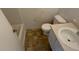 Standard bathroom featuring a toilet, sink and shower/tub at 4990 Windsor Downs Dr, Decatur, GA 30035
