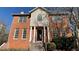 Two-story brick home with a gable roof and white-trimmed windows at 4990 Windsor Downs Dr, Decatur, GA 30035
