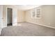 Spacious bedroom with ample closet space and neutral carpeting at 4079 Parks Ln, Douglasville, GA 30135