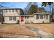 Two-story house with a red door and well-maintained lawn at 4079 Parks Ln, Douglasville, GA 30135